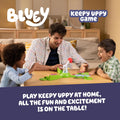 Bluey Keepy Uppy Game. Help, Bingo, and Chilli Keep the Motorized Balloon in the Air with the Character Paddles for 2-3 Players. Ages 4+