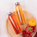 GUANENA 12 Pack Glass Water Bottles, 16oz Clear Glass Bottles with Stainless Steel Lids, Reusable Glass Drink Bottles with Caps for Juicing,