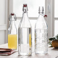 Bormioli Rocco Set of 2 Moresca Bottles, 33.75 Oz. Clear Textured Glass, with Swing Top Hermetic Lid, Leak Proof Water Bottle, Dishwasher Safe,